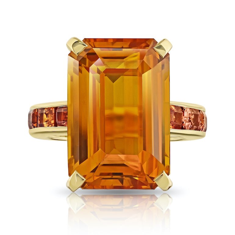 21.05 carat Emerald Cut Orange Sapphire and 20k YG Ring