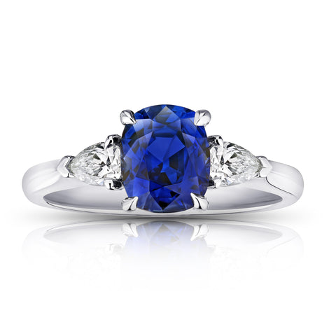 12.04 carat Oval Orange Sapphire with two Half Moon Diamonds in 18k YG ring
