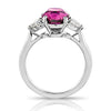 4.49 carat Oval Pink Sapphire with two Heart Diamonds in a Platinum ring - David Gross Group